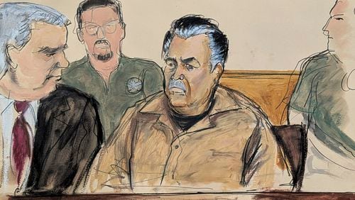 In this courtroom sketch, Ismael Zambada Garcia, El Mayo, center, is seated beside his defense attorney Frank Perez, left, in Federal court, in the Brooklyn borough of New York, Friday, Sept. 13, 2024. (Elizabeth Williams via AP)