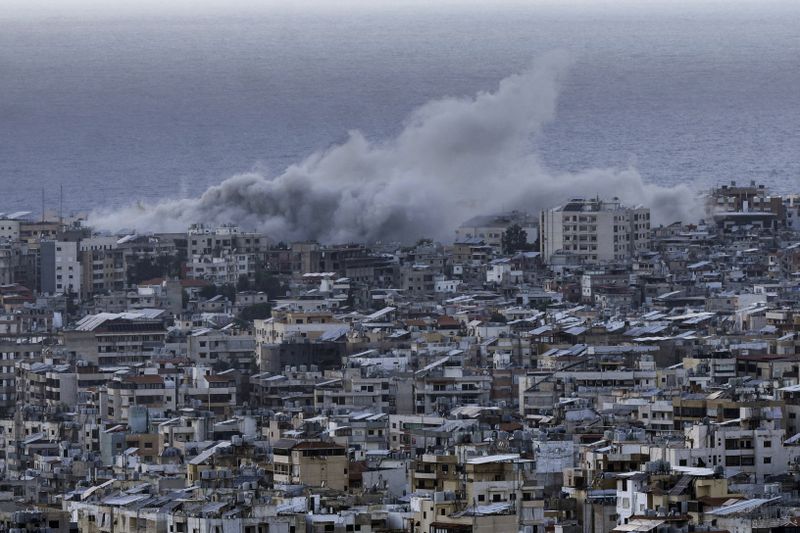 Smoke rises from the site of an Israeli airstrike in Dahiyeh, Beirut, Lebanon, Tuesday, Oct. 1, 2024. (AP Photo/Bilal Hussein)