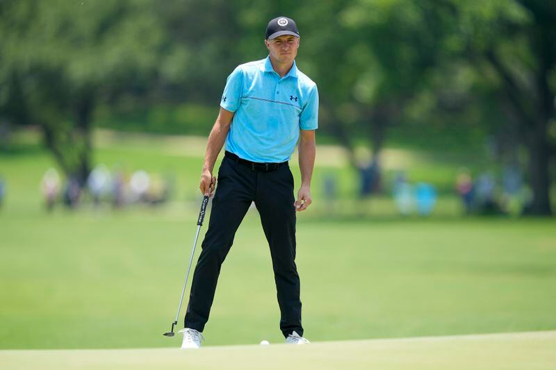 Jordan Spieth lines up his putt on the 10th green during the first round of the Charles Schwab Challenge golf tournament at Colonial Country Club, Thursday, May 23, 2024, in Fort Worth, Texas. (AP Photo/LM Otero)