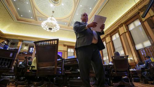 Rep. Devan Seabaugh, R-Marietta, walks in the House Chambers during day 40 of the legislative session at the State Capitol on Wednesday, March 29, 2023. Jason Getz / Jason.Getz@ajc.com)
