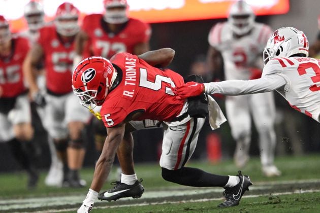 Georgia wide receiver Rara Thomas (5) makes a move after a catch during the first half in an NCAA football game at Sanford Stadium, Saturday, November 11, 2023, in Athens. Georgia won 52-17 over Mississippi. (Hyosub Shin / Hyosub.Shin@ajc.com)
