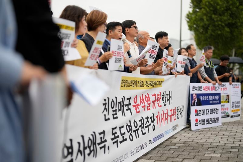 Protesters attend a rally opposing a planned meeting between South Korean President Yoon Suk Yeol and Japanese Prime Minister Fumio Kishida near the Presidential Office in Seoul, South Korea, Friday, Sept. 6, 2024. (AP Photo/Lee Jin-man)