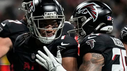 Atlanta Falcons running back Bijan Robinson (7) celebrates his touchdown against the Kansas City Chiefs during the first half of an NFL football game, Sunday, Sept. 22, 2024, in Atlanta. (AP Photo/Brynn Anderson)