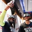 Atlanta Braves designated hitter Marcell Ozuna (20) takes a selfie with Matt Olson (28) in the locker rooms. 
(Miguel Martinez/ AJC)