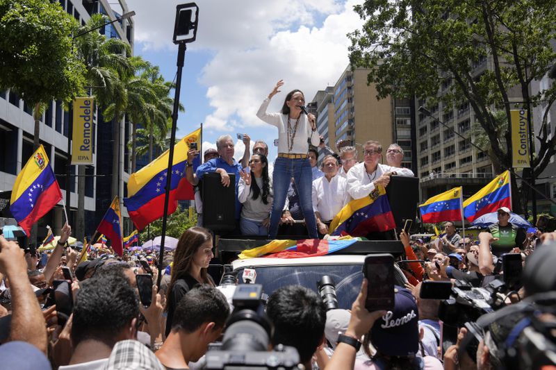 Maria Corina Machado leads a protest against the reelection of President Nicolás Maduro one month after the disputed presidential vote which she claims the opposition won by a landslide, in Caracas, Venezuela, Wednesday, Aug. 28, 2024. (AP Photo/Ariana Cubillos)