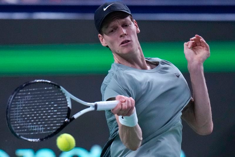 Jannik Sinner of Italy returns a forehand shot to Tomas Martin Etcheverry of Argentina during the men's singles match in the Shanghai Masters tennis tournament at Qizhong Forest Sports City Tennis Center in Shanghai, China, Sunday, Oct. 6, 2024. (AP Photo/Andy Wong)