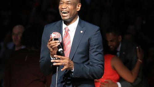 112415 ATLANTA: -- Hawks Legend Dikembe Mutombo is all smiles as he has his No. 55 jersey retired by the Hawks during half time in a basketball game against the Celtics on Tuesday, Nov. 24, 2015, in Atlanta.  Curtis Compton / ccompton@ajc.com