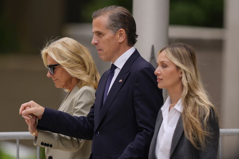 Hunter Biden, center, is accompanied by his mother, first lady Jill Biden, (left) and his wife, Melissa Cohen Biden (right) after being convicted in a federal gun trial on Tuesday.