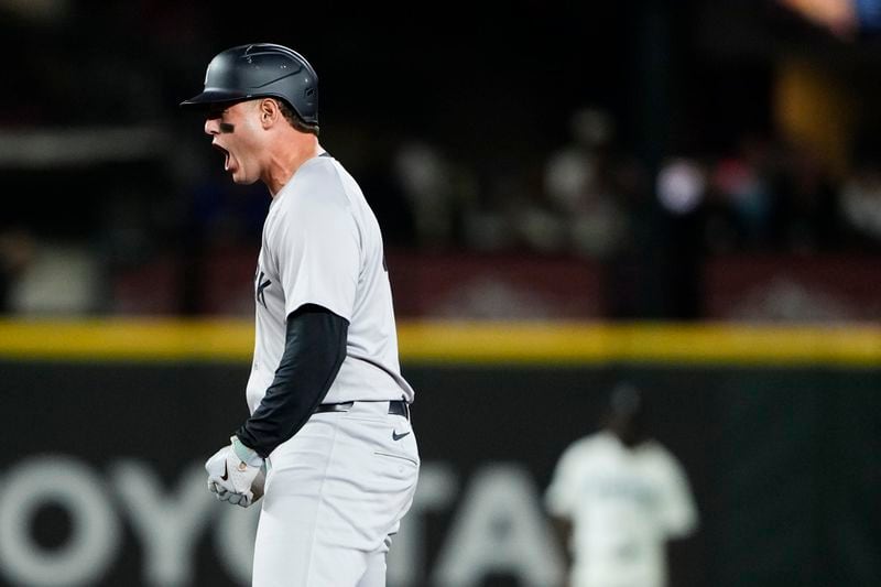 New York Yankees' Anthony Rizzo reacts after hitting an RBI double against the Seattle Mariners during the 10th inning of a baseball game Wednesday, Sept. 18, 2024, in Seattle. (AP Photo/Lindsey Wasson)