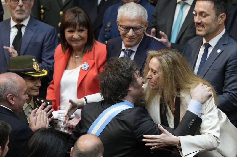 Argentina's President Javier Milei greets his sister Karina Milei as he arrives at Congress to present the 2025 budget in Buenos Aires, Argentina, Sunday, Sept. 15, 2024. (AP Photo/Natacha Pisarenko)