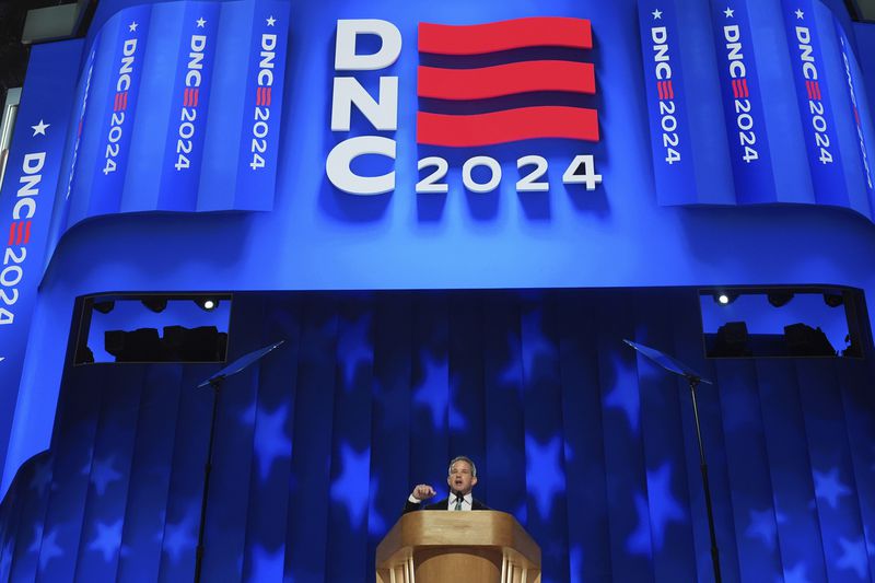 Adam Kinzinger, former member of the U.S. House of Representatives from Illinois speaks during the Democratic National Convention Thursday, Aug. 22, 2024, in Chicago. (AP Photo/Paul Sancya)