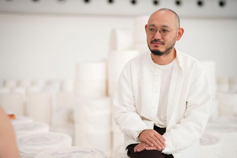 Designer Satoshi Kondo is interviewed by the Associated Press after the Issey Miyake Spring/Summer 2025 collection presented Friday, Sept. 27, 2024 in Paris. (Photo by Scott A Garfitt/Invision/AP)