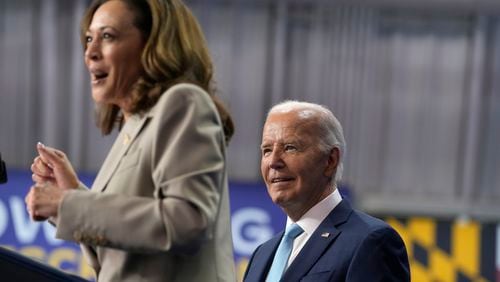 President Joe Biden, right, listens as Democratic presidential nominee Vice President Kamala Harris speaks about the administration's efforts to lower costs during an event at Prince George's Community College in Largo, Md., Thursday, Aug. 15, 2024. (AP Photo/Susan Walsh)