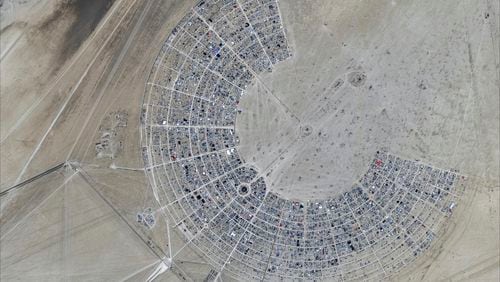 This image released by Maxar Technologies shows an overview of the Burning Man 2024 festival, Sunday, Aug. 25, 2024, in Black Rock City, Nev. (Satellite image ©2024 Maxar Technologies via AP)