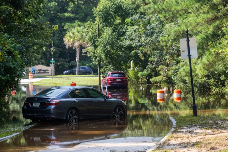 Cars were stuck on a flooded road on Bradley Boulevard on Monday in Savannah. (AJC Photo/Katelyn Myrick)