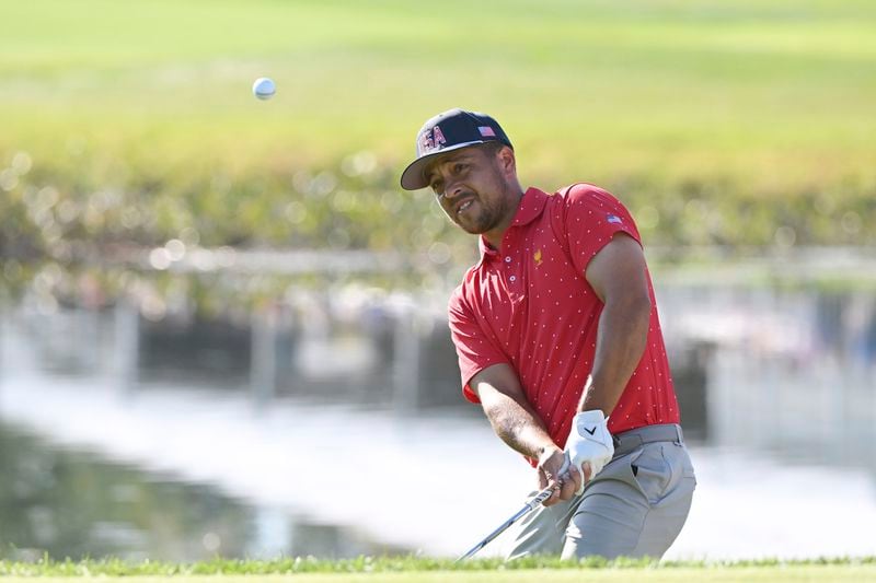 United States team member Xander Schauffele hits onto the 15th green during a fifth-round singles match at the Presidents Cup golf tournament at Royal Montreal Golf Club, Sunday, Sept. 29, 2024, in Montreal. (Graham Hughes/The Canadian Press via AP)