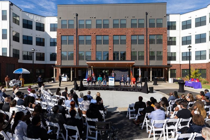 Egbert Perry, chairman of the Integral Group, speaks at the grand opening ceremony for the new apartment building Veranda at Assembly in Doraville on Thursday. The Assembly redevelopment site was formerly a GM plant. ARVIN TEMKAR/AJC