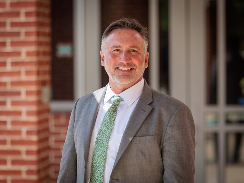 Fulton County Schools Superintendent Mike Looney poses for a portrait at Sandy Springs Charter Middle School in Sandy Springs on Monday, August 8, 2022. Like many educators, Looney is looking for ways to reduce chronic absenteeism in schools. (Arvin Temkar / AJC)