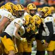 Kennesaw State quarterback Davis Bryson (9) talks during a huddle in the second half of an NCAA college football game against UTSA, Saturday, Aug. 31, 2024, in San Antonio. (AP Photo/Darren Abate)