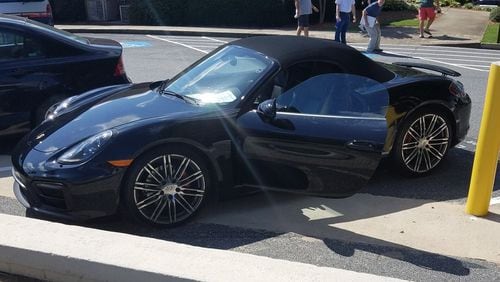 The owner of a Porsche has been charged with reckless conduct after a note stating his car was wired to explode was left in plain view. Credit: Marietta Police Department