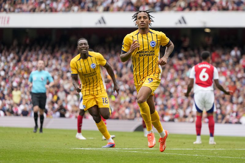 Brighton's Joao Pedro celebrates after scoring his side's opening goal during the English Premier League soccer match between Arsenal and Brighton, at Emirates Stadium in London, Saturday, Aug. 31, 2024. (AP Photo/Alastair Grant)