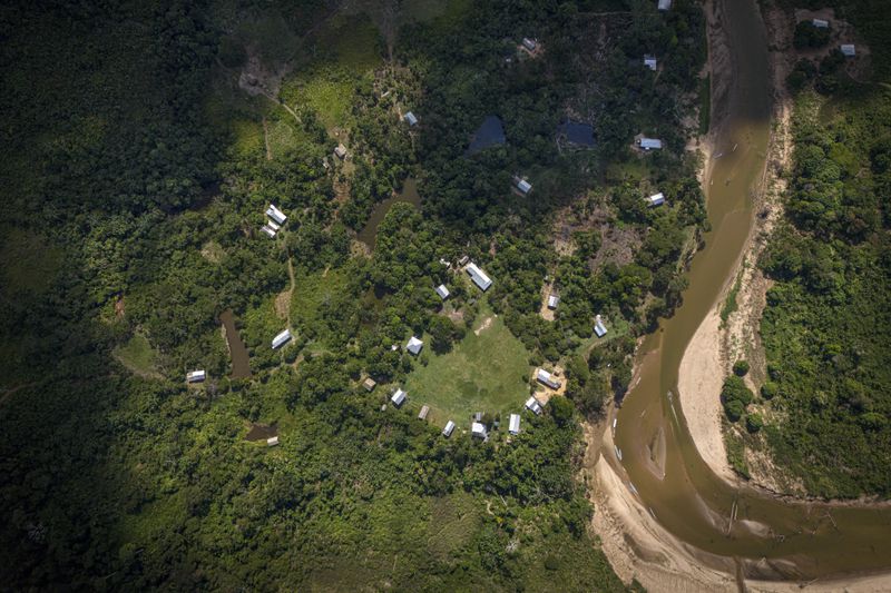 Apolima-Arara Indigenous village is visible next to the Amonia River, in Nordestino, Acre state, Brazil, Tuesday, June 25, 2024. (AP Photo/Jorge Saenz)