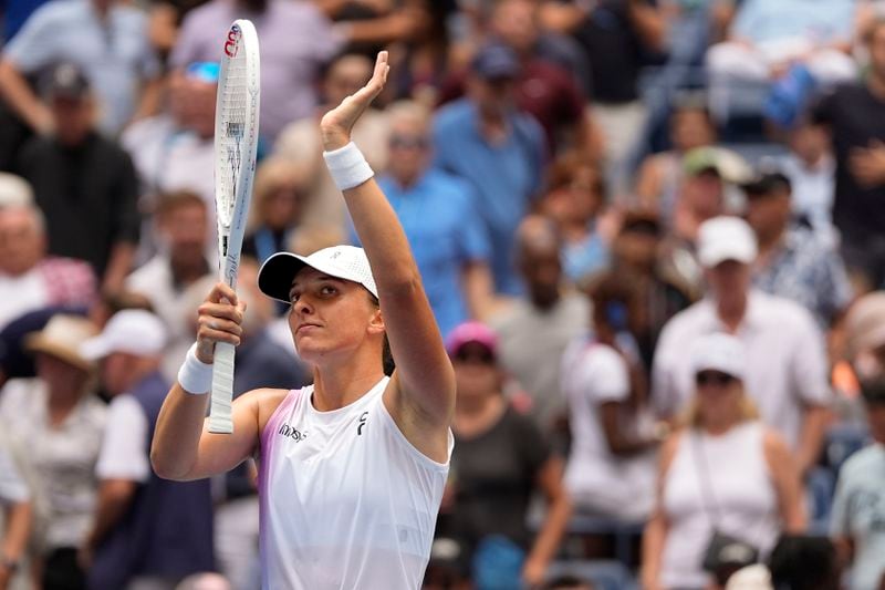 Iga Swiatek, of Poland, waves to the crowd after defeating Ena Shibahara, of Japan, during the second round of the U.S. Open tennis championships, Thursday, Aug. 29, 2024, in New York. (AP Photo/Julia Nikhinson)