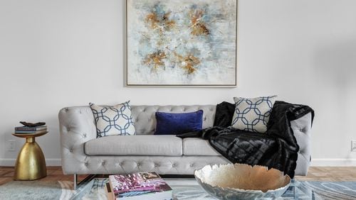 Don t be afraid to mix different fabrics or materials. Here, silk pillows are paired with a velvet accent pillow and faux fur throw. (Design Recipes/TNS)