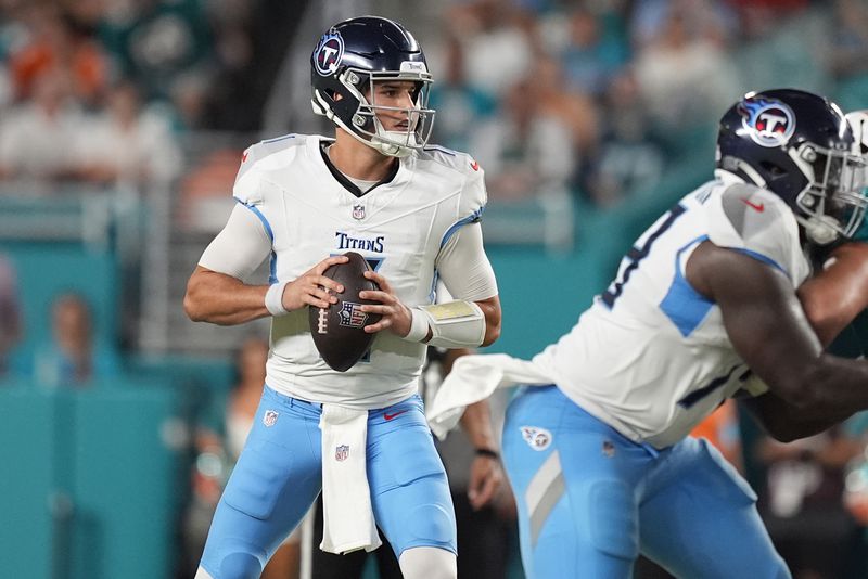 Tennessee Titans quarterback Mason Rudolph (11) aims a pass during the first half of an NFL football game against the Miami Dolphins, Monday, Sept. 30, 2024, in Miami Gardens, Fla. (AP Photo/Rebecca Blackwell)