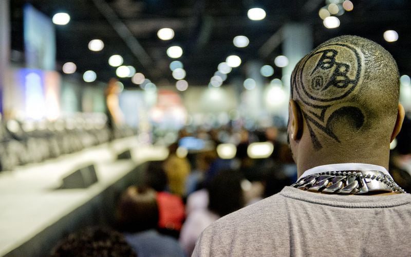 Michael Hood (right) waits for the start of the barber competition during the 2015 Bronner Bros. International Beauty Show at the Georgia World Congress Center in Atlanta in this Sunday, February 22, 2015 file photo. J