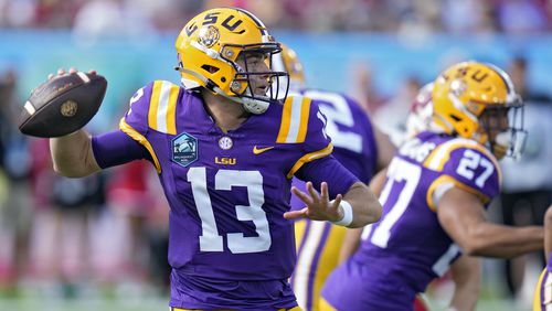 FILE - LSU quarterback Garrett Nussmeier throws a pass against Wisconsin during the first half of the ReliaQuest Bowl NCAA college football game, Jan. 1, 2024, in Tampa, Fla. (AP Photo/Chris O'Meara, File)