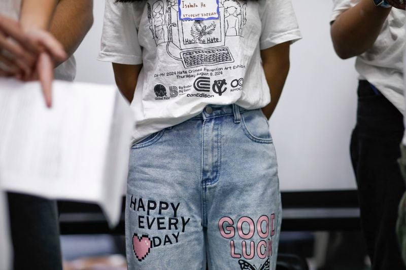 Students attend the opening of the art contest named "Hacked the Hate" made by young artist during the Summer, Thursday Aug. 8, 2024, in New York. (AP Photo/Kena Betancur)