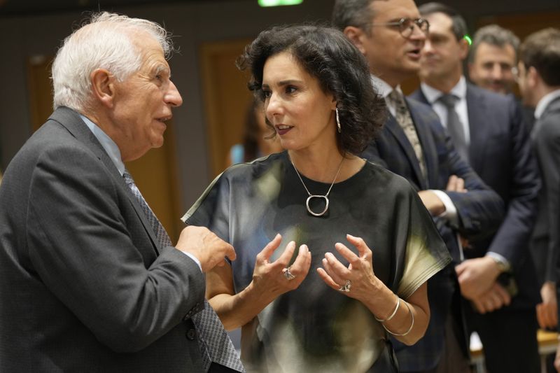 European Union foreign policy chief Josep Borrell, left, speaks with Belgium's Foreign Minister Hadja Lahbib during a meeting of EU foreign ministers at the European Council building in Brussels, Thursday, Aug. 29, 2024. (AP Photo/Virginia Mayo)