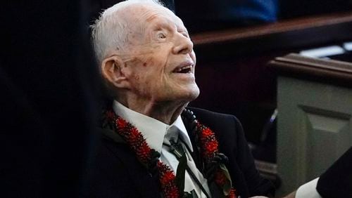 FILE - Former President Jimmy Carter greets attendees as he departs the funeral service for his wife, former first lady Rosalynn Carter, at Maranatha Baptist Church in Plains, Ga., Nov. 29, 2023. (AP Photo/Alex Brandon, Pool, File)