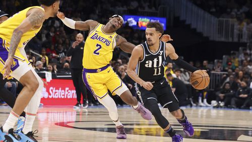 Atlanta Hawks guard Trae Young (11) drives against Los Angeles Lakers forward Jarred Vanderbilt (2) during the first half at State Farm Arena, Tuesday, January 30, 2024, in Atlanta. (Jason Getz / jason.getz@ajc.com)