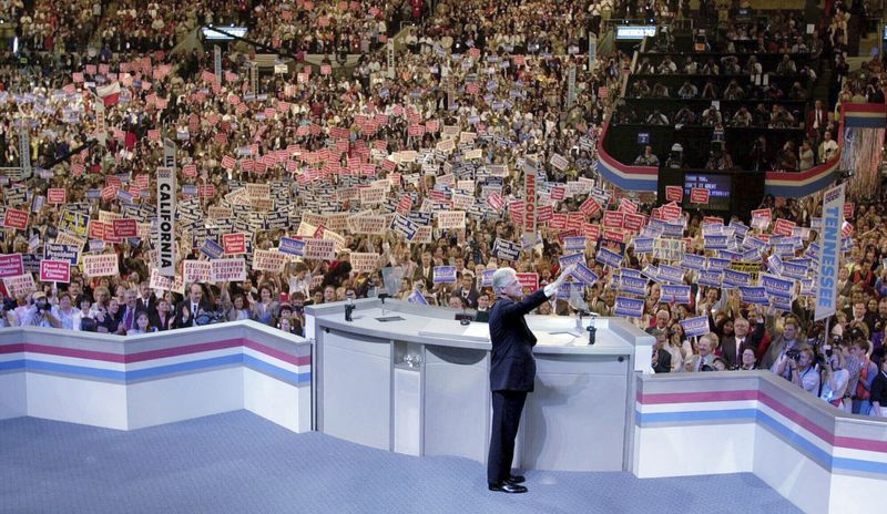 FILE - President Bill Clinton waves to the crowd as he takes the stage to speak at the Democratic National Convention, Aug. 14, 2000 in Los Angeles. (AP Photo/Bob Galbraith, file)