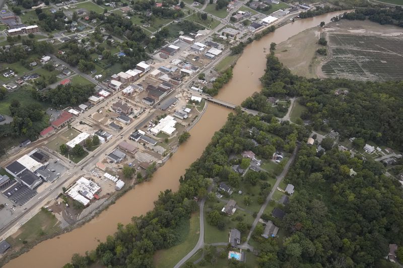 An aerial view of flood damage along the Pigeon River left by Hurricane Helene, Saturday, Sept. 28, 2024, in Newport, Tenn. (AP Photo/George Walker IV)