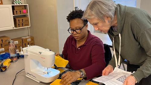 Volunteer teacher Fonde Werts helps Candice Boles with the next step of her quilt at the Women's Transitional Center. 
(Courtesy HeartBound Ministries)