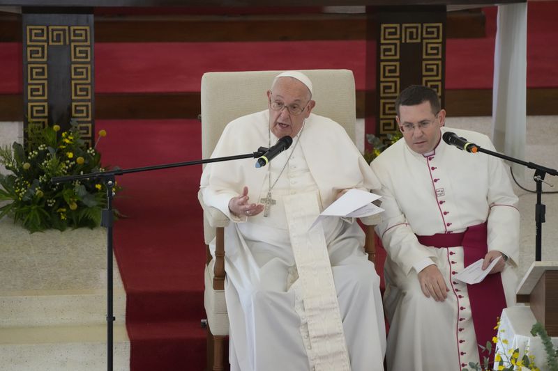 Pope Francis meets with a group of elderly and sick people at the St. Theresa's Home in Singapore, Friday, Sept. 13, 2024. Pope Francis is wrapping up his visit to Singapore by praising its tradition of interfaith harmony. (AP Photo/Gregorio Borgia)