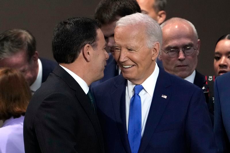 Prime Minister of Portugal Luis Montenegro, left, speaks with President Joe Biden at Working Session II of the NATO Summit in Washington, Thursday, July 11, 2024. (AP Photo/Susan Walsh)