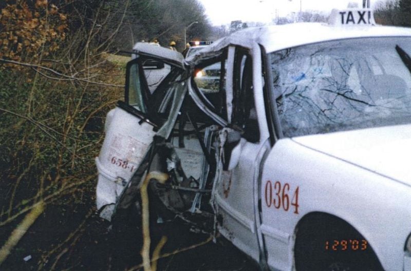 Photos from the crash scene show the Atlanta taxi in which Patricia Heller died on I-85 in January 2003.