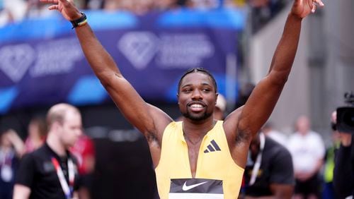 Winner Noah Lyles of the U.S. celebrates after the Men's 100m Final during the Diamond League London Athletics Meet in London, England, Saturday, July 20, 2024. (Adam Davy/PA via AP)