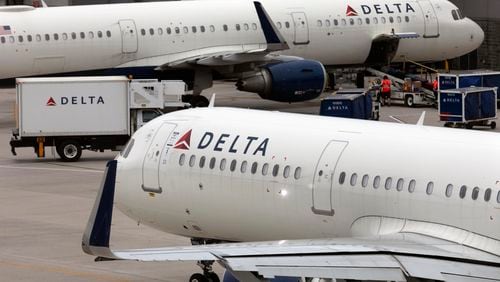 FILE - A Delta Air Lines plane leaves the gate, July 12, 2021, at Logan International Airport in Boston. (AP Photo/Michael Dwyer, File)