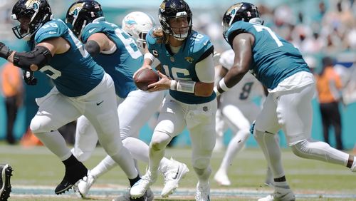 Jacksonville Jaguars quarterback Trevor Lawrence (16) looks to pass the ball during the first half of an NFL football game against the Miami Dolphins, Sunday, Sept. 8, 2024, in Miami Gardens, Fla. (AP Photo/Rebecca Blackwell)