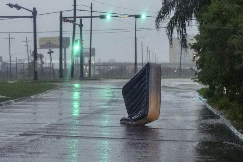 An air mattress blows in wind from Hurricane Francine in New Orleans, Wednesday, Sept. 11, 2024. (AP Photo/Matthew Hinton)