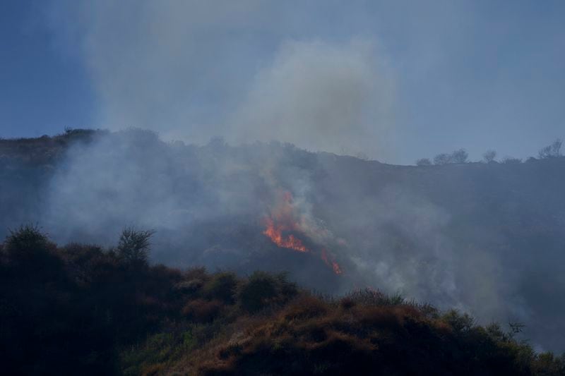 Flames burn on a hillside during the Sharp Fire in Simi Valley, Wednesday, July 3, 2024. (AP Photo/Eric Thayer)