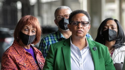 The 11th Circuit Court of Appeals on Wednesday denied a quest for a new trial for former Atlanta official Mitzi Bickers (pictured here in green blazer). (Jenni Girtman for The Atlanta Journal-Constitution)