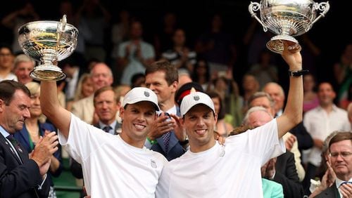 Bob Bryan and Mike Bryan of the United States celebrate their victory in men's doubles at the Wimbledon Championships on Saturday, July 6, 2013, in Wimbledon, England. (Imago via Zuma Press/MCT)