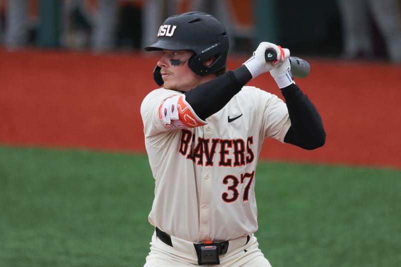 FILE - Oregon State infielder Travis Bazzana bats during an NCAA baseball game against Arizona State on April 6, 2024, in Corvallis, Ore. The Cleveland Guardians have the No. 1 overall pick in next week's draft. They have narrowed the talent pool to just a few possibilities with Oregon State second baseman Bazzana, Georgia outfielder/third baseman Charlie Condon and West Virginia middle infielder Wetherholt believed to be the frontrunning options. (AP Photo/Amanda Loman, File)