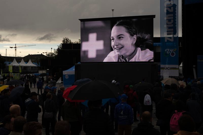 A picture of cyclist Muriel Furrer from Switzerland who died after a crash Thursday, is projected during a minute of silence prior to the medal ceremony of the Men Under 23 Road Race of the Cycling and Para-cycling Road World Championships in Zurich, Switzerland, Friday, Sept. 27, 2024. (AP Photo/Peter Dejong)